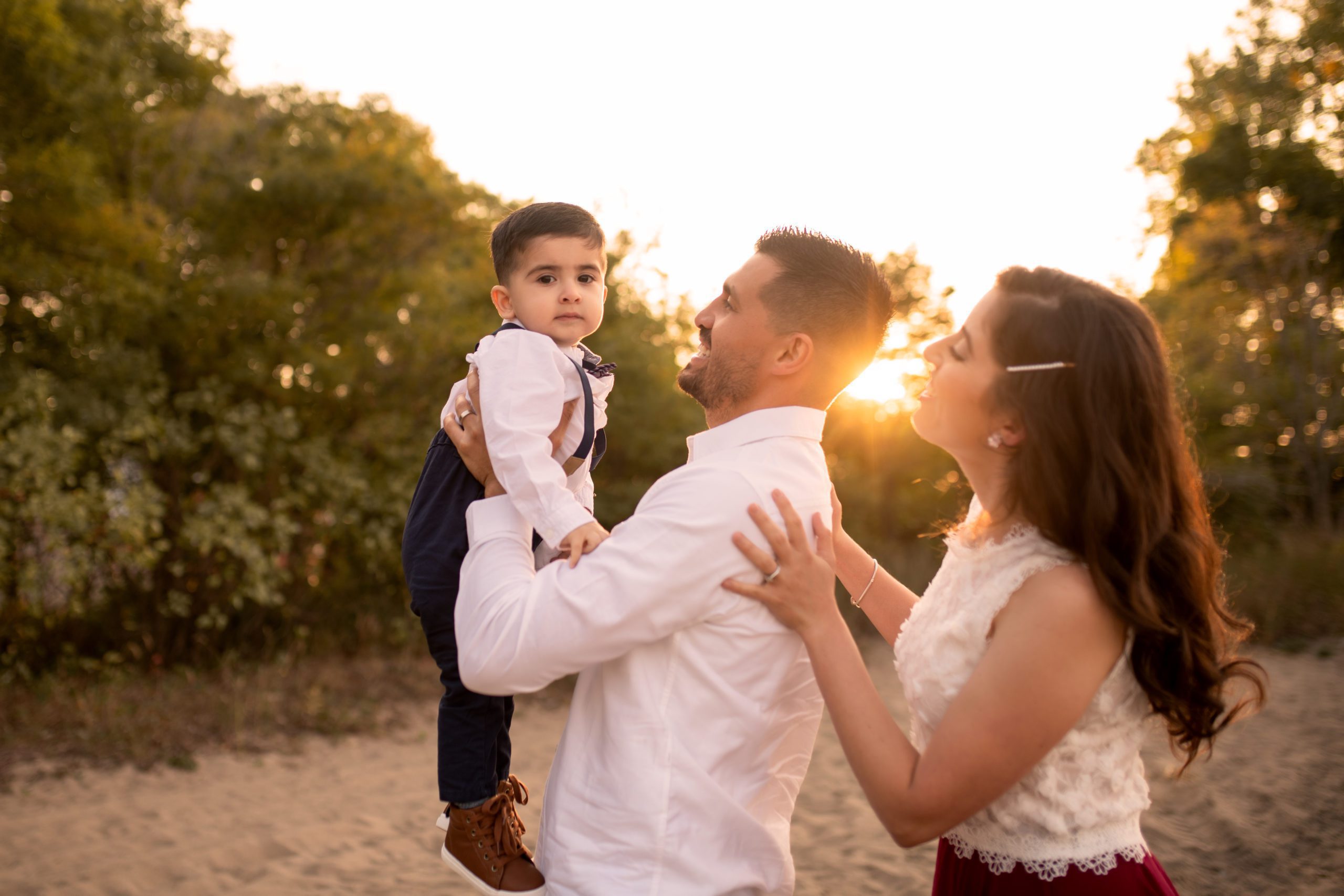 golden hour family photo session of family of three in Erie Pennsylvania by Maria Angeles photgraphy